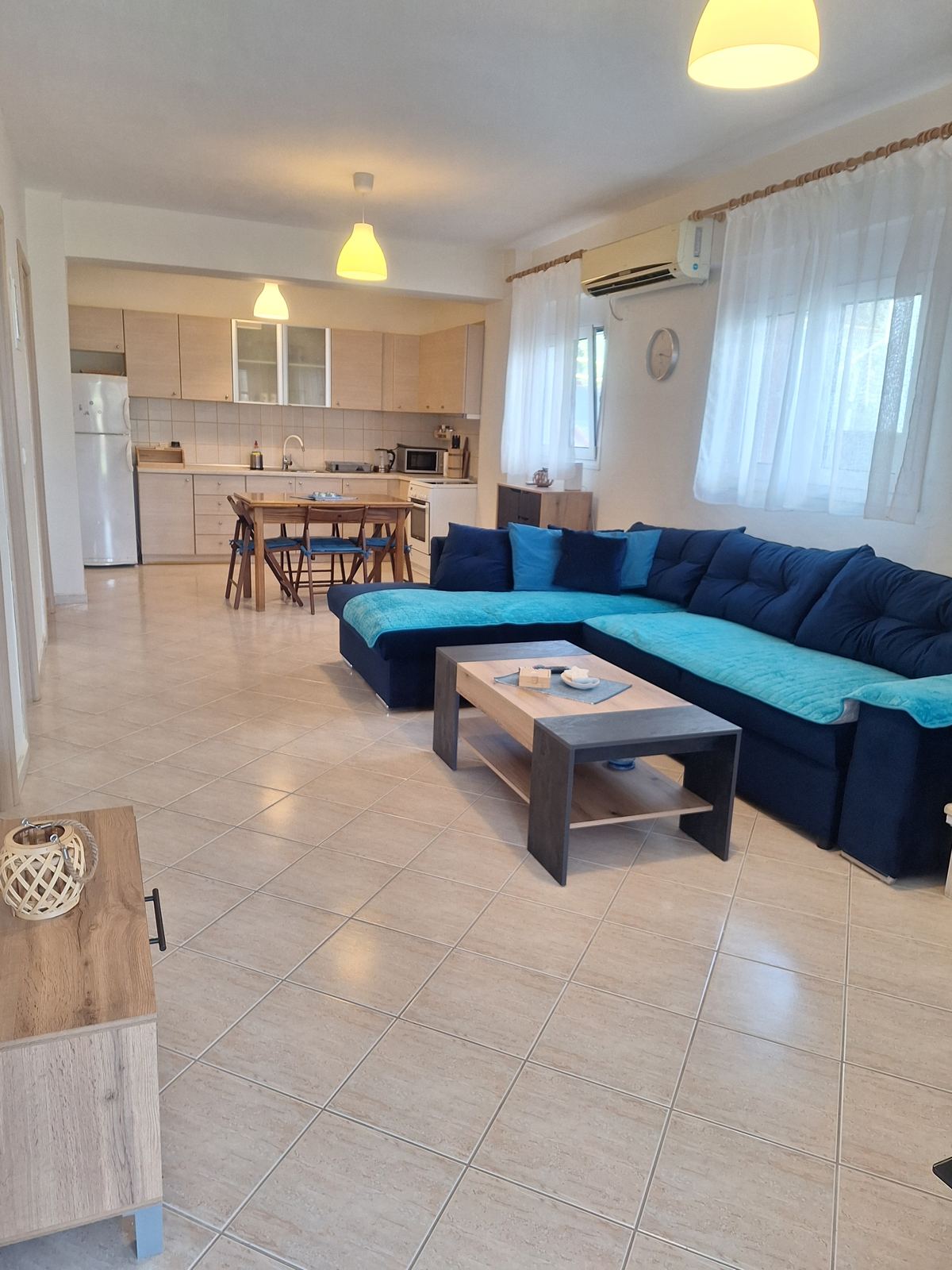Bunterakis 1 living room with sofa and kitchen